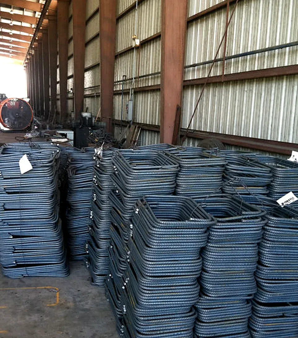 Tagged bundles of bent reinforcing steel on the shop floor